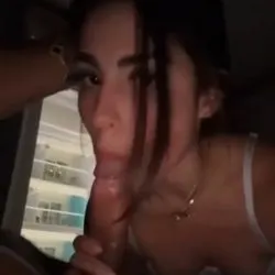 Holding her hair back sucking dick